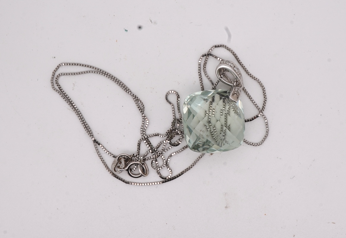 A prasiolite and diamond pendant, the diamond-set bail suspending a cushion-shaped chequerboard-cut prasiolite, to a fine link chain, mounted in 14ct gold, pendant length 2.5cm, chain length 46cm, British hallmarks, gros